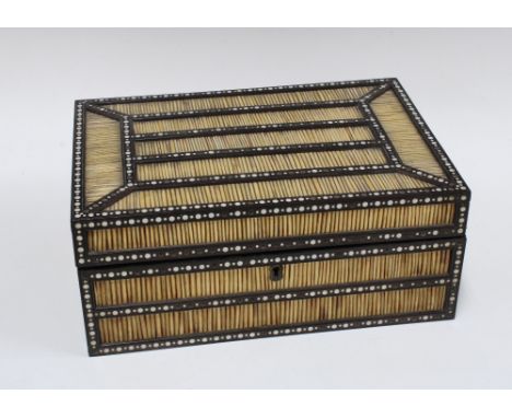 Porcupine quill and ebony box, with bone and ivory inlaid pattern, with a lift out tray with compartments, 33 x 14 x 23cm.  (