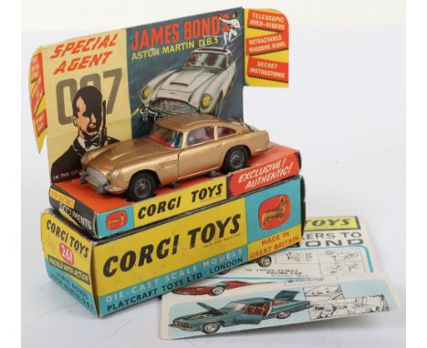 Corgi Toys 261 James Bond Aston Martin D.B.5 from the Film “Goldfinger” gold body, with working ejector seat, rear bullet scr