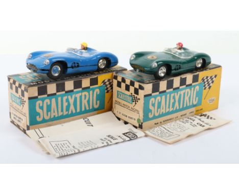 Two Vintage Boxed Scalextric Aston Martins DBR1,C57 green body, with instruction leaflet and E2 with lighting circuit leaflet