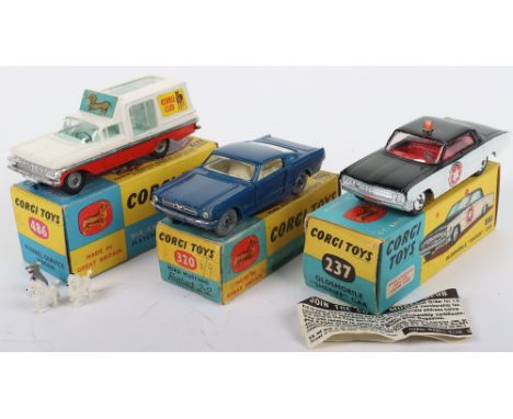 Three Boxed Vintage Corgi Toys USA Models,237 Oldsmobile Sheriff’s car, black/white body, red interior, spun shaped wheels, w