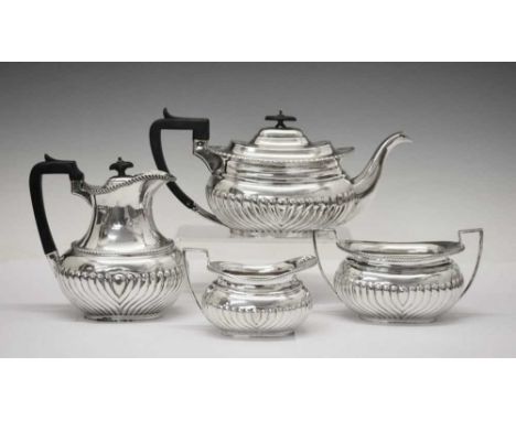 Early 20th Century four-piece silver tea set, comprising teapot, hot water jug, two-handled sugar basin and milk jug, all wit