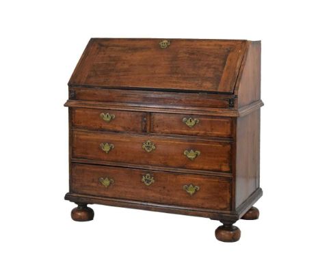 Early 18th Century fruitwood bureau, the sloping fall enclosing a shaped and stepped fitted interior with ebony and boxwood-s