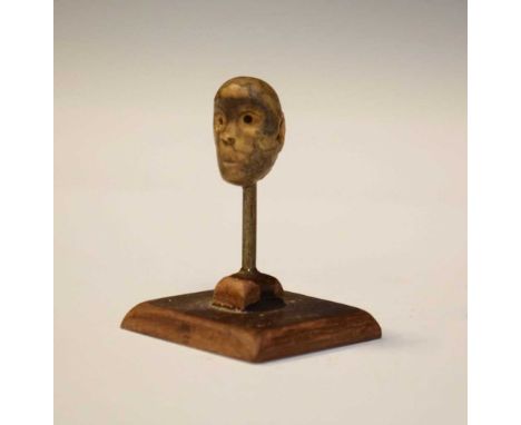 Antiquities - Pre Columbian (Mayan) head bead, modelled as the head of a figure, ears pierced for stringing, 13mm, on wooden 
