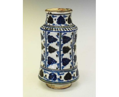 Mediterranean pottery albarello or drug jar, of typical waisted form, decorated with foliate friezes and conforming vertical 