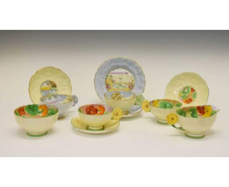 Group of 1930s Paragon flower handled and moulded teawares, printed, painted and gilded in various patterns, to include 'Foun