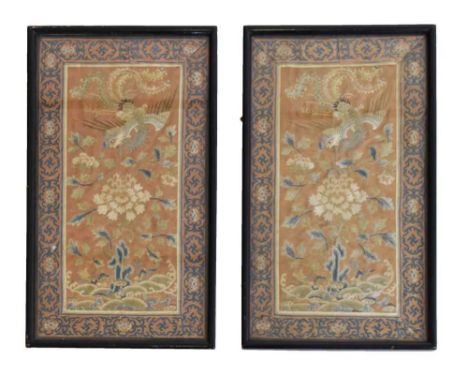 Pair of 19th Century Chinese silk panels, each depicting a fenghuang or phoenix flying over a garden landscape on a rust-colo