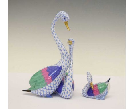 Herend, Hungary - Porcelain model swan figure group and single model, both painted and gilded in light-blue with pink, blue a