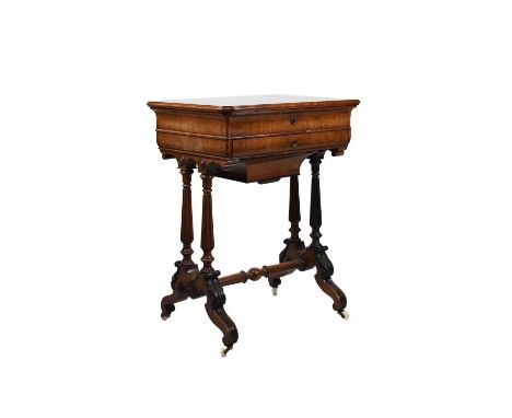 Victorian rosewood and ebonised work table, the hinged rectangular moulded top enclosing maple lined interior with arrangemen