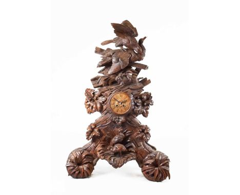 Impressive Black Forest carved linden wood table clock, circa 1900, with cellular Roman dial, Japy Freres two-train movement 