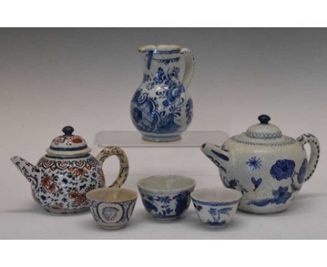 Group of early 18th Century Dutch Delftware, comprising baluster jug with floral cartouche decoration, bullet shaped teapot, 