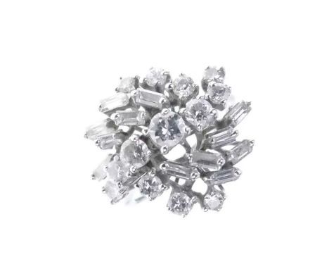 Diamond cluster ring, stamped '750', set with brilliant cuts and baguettes, the twenty-five diamonds estimated as totalling a