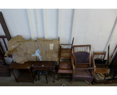 A child's cot, wicker chair, two oak fenders, Olympia typewriter, standard lamp, etc.
