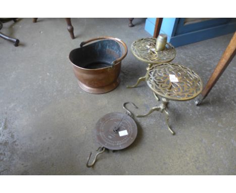 A pair of brass trivets, Salter scales and a copper coal scuttle