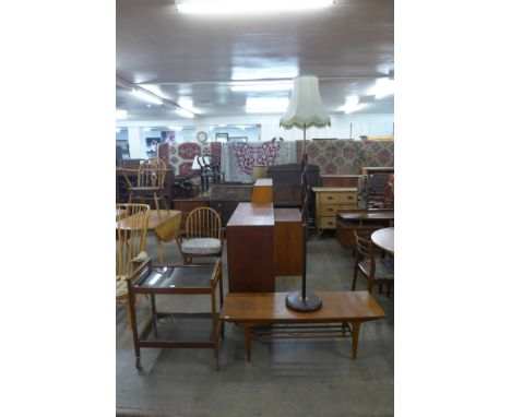 A teak coffee table, trolley and standard lamp