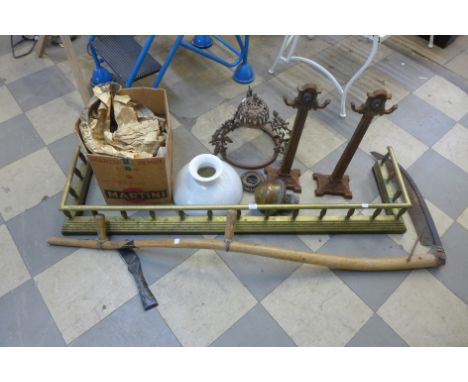 A brass fender, scythe, hanging oil lamp, etc.
