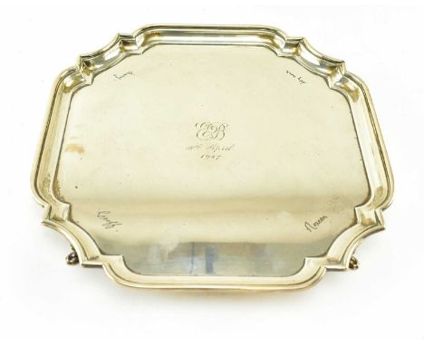 A George VI hallmarked silver tray, raised on scroll terminal feet with raised edges. Hallmarked Birmingham 1938, sponsors ma
