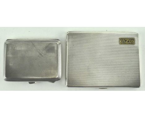 Two hallmarked silver cigarette cases. The lot to include a George VI rectangular engine turned with SNS initials. Hallmarked