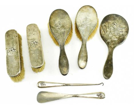 A Victorian hallmarked silver seven-pieces dressing table set and others. The set to include a mirror, two brushes, two cloth