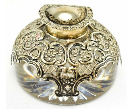 A Victorian hallmarked silver mounted glass inkwell. Hallmarked year 1897, London. Sponsors mark for William Comyns &amp; Son