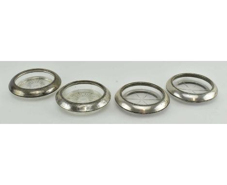 A collection of 20th century American sterling silver counted cystal glass coasters. Each marked for Frank M &amp; Whiting St