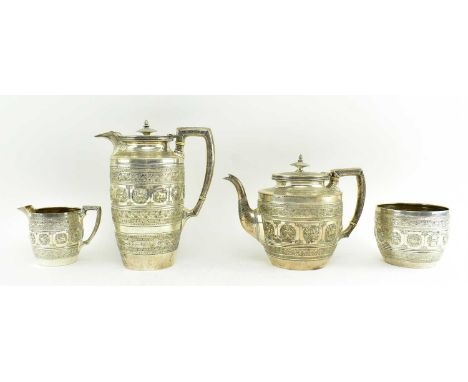 A set of four Victorian hallmarked silver four-piece tea service. The lot comprising teapot, coffee pot, mug, bowl and creame