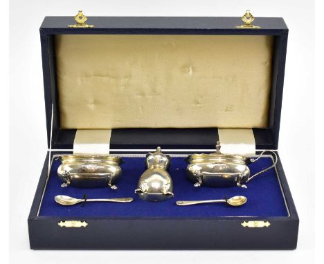 A cased silver cruet set to include mustard pot, open salt pot and pepper shaker, hallmarked year 1993 Birmingham, sponsors m