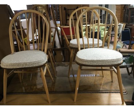 Four blonde Ercol dining table &amp; chairs including two carver chairs (mixed designs).