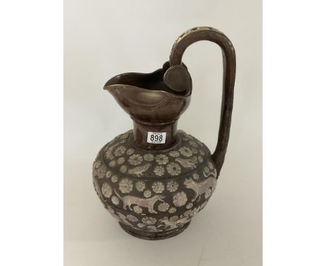 A large brown glazed Castle Hedingham pottery ewer, by Edward Bingham, 44cm.