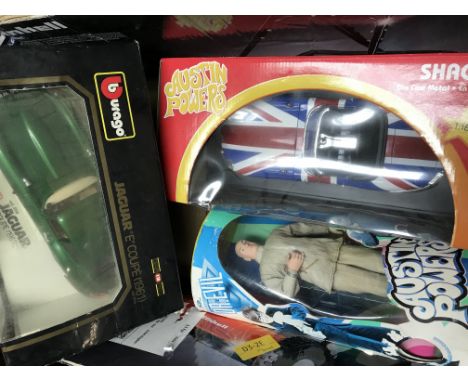 A bag containing a collection of toys including Austin Powers, Sweep, Meerkat movie items etc
