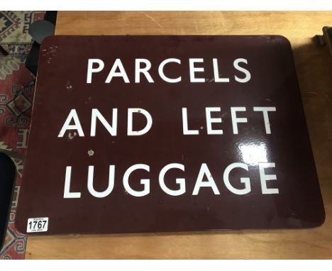 A enamel railway sign Parcels and left Luggage 60 cm by 45 cm .