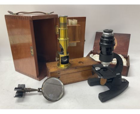 A miniature cased travelling microscope, a cased Britex minor 6541, together with a box of slides.