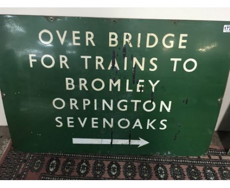 A large green enamel Railway sign Over Bridge for Trains to Bromley and Orpington Sevenoaks. 92 cm x 62 cm .