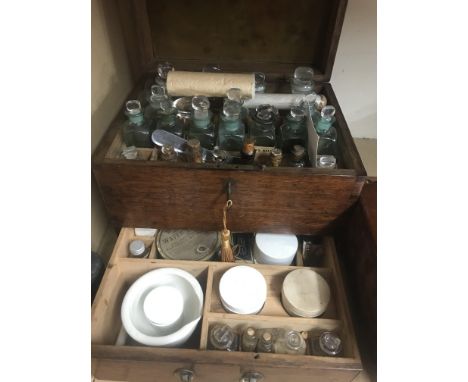 A Georgian oak apothecary box various bottles one other apothecary box and microscope.