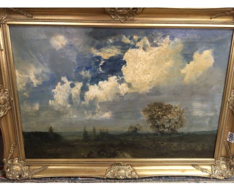 A gilt framed oil on canvas depicting countryside scene signed R Noble. 75cm x 50cm