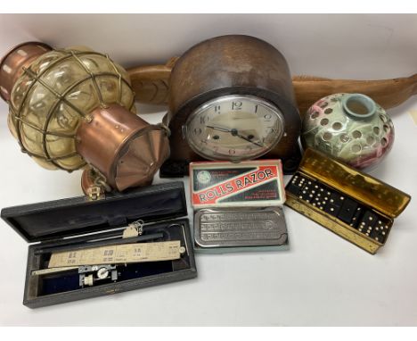 A vintage 1940â€™s wooden Flymo England mantle clock with key, carved wooden fish, rolls razor, empire dominos, match boxes, 