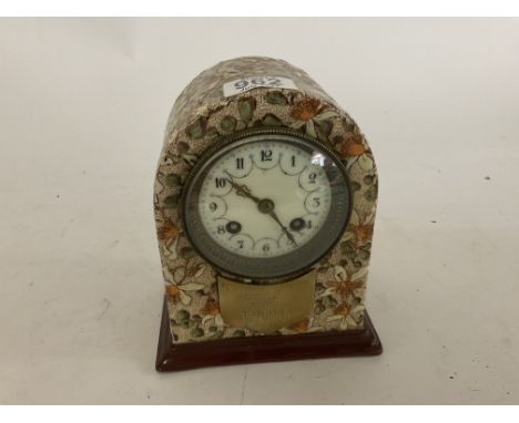 A ceramic cased mantle clock with a brass plaque attached to the front reading Cumberland Fox Hounds, 1892, 2nd Prize. Poss. 