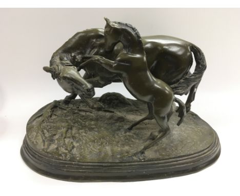 A bronze figural group of a horse and foal, approx height 25cm.