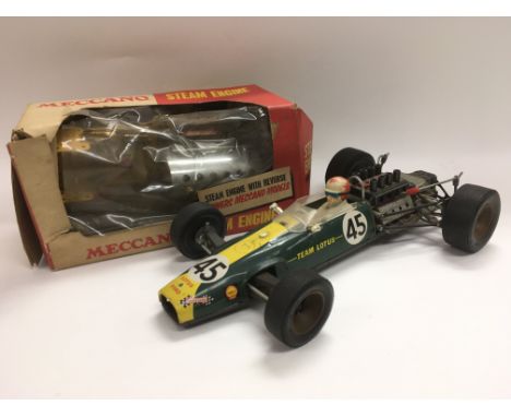 A boxed Meccano steam engine R1013 and a vintage Japanese Junior model of an F1 Lotus racing car.