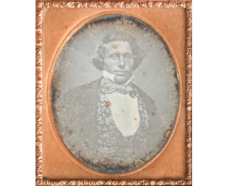 Photography. A quarter-plate daguerreotype portrait of a gentleman, c. 1850-56, half-length, seated and face-on, cased, 9.1 x
