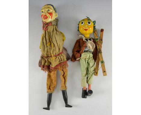 Hand puppet of a clown with painted head and wooden hands and boots, and a Pelham Puppets Mr Turnip 