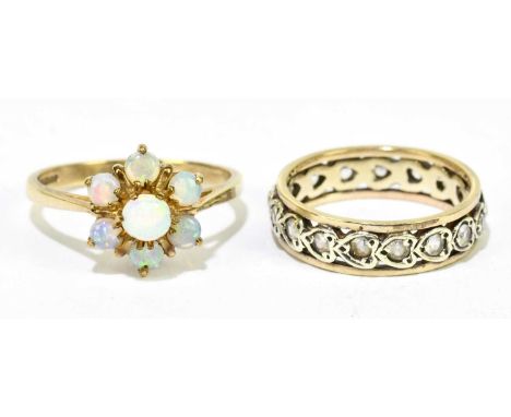 A 9ct yellow gold and opal floral cluster ring, size L 1/2, and a 9ct eternity ring, size J, combined weight approx. 5.2g (2)