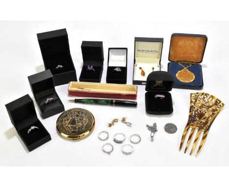 A collection of ten modern gem set costume and dress rings, with a paste set necklace, a compact, a hair slide and other item