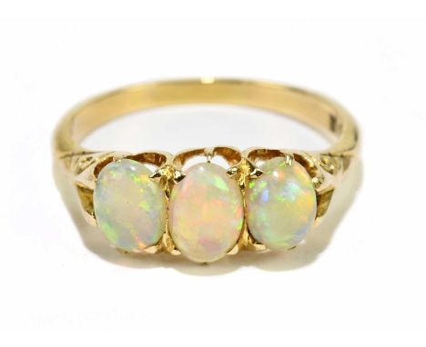 A 15ct yellow gold and three stone opal ring, size L 1/2, approx. 2.9g.