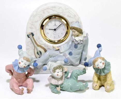 LLADRO; a figural mantel clock representing a jester seated beside a lute, with quartz movement, height 21cm, together with t