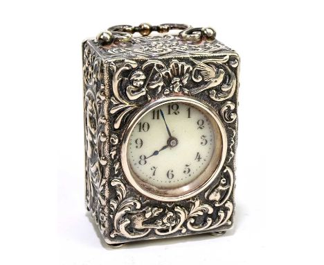 GOLDSMITHS &amp; SILVERSMITHS CO; an Edward VII hallmarked silver cased carriage clock of rectangular form, with shaped swing