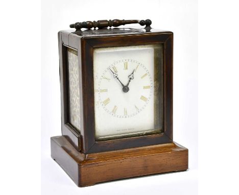 A late 19th century French rosewood cased carriage clock with Roman numerals to the white enamel dial inscribed 'H.R.Y Marc, 