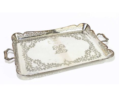 An Edwardian pierced silver plated twin handled tray of serpentine rectangular form, length 65cm.Condition Report: General li