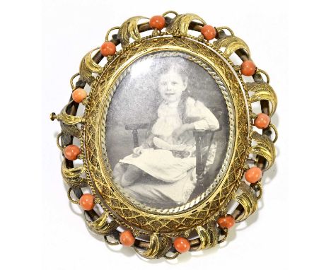 A large late Victorian yellow metal coral bead set brooch with central portrait section, approx 65 x 60mm. 