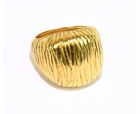 A yellow metal textured signet ring stamped 750, size M 1/2, approx weight 12.1g.