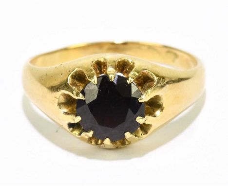 A yellow metal garnet set signet ring, size Q, approx. 6g. 